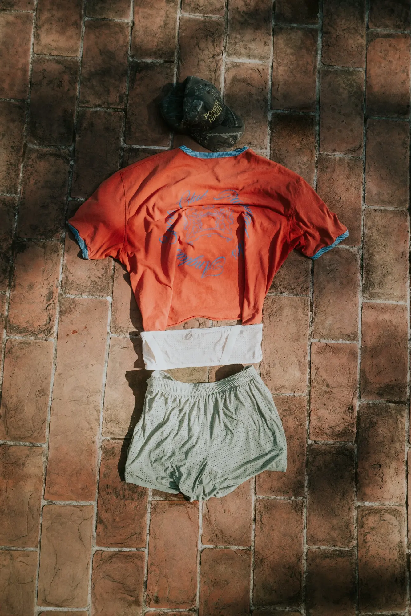 A Currently Running kit laid out on brick