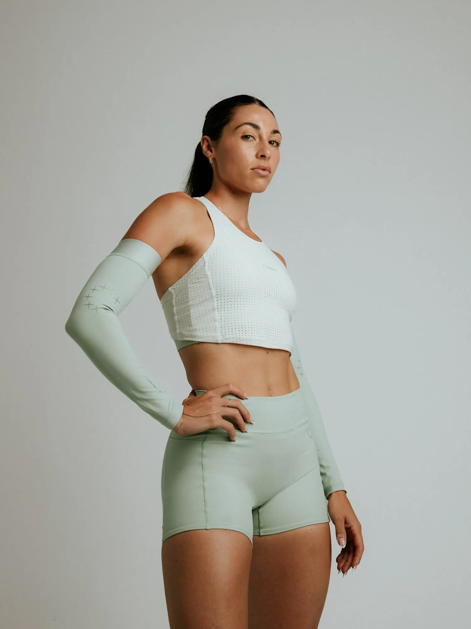 A runner in a sage top and shorts, Currently Running