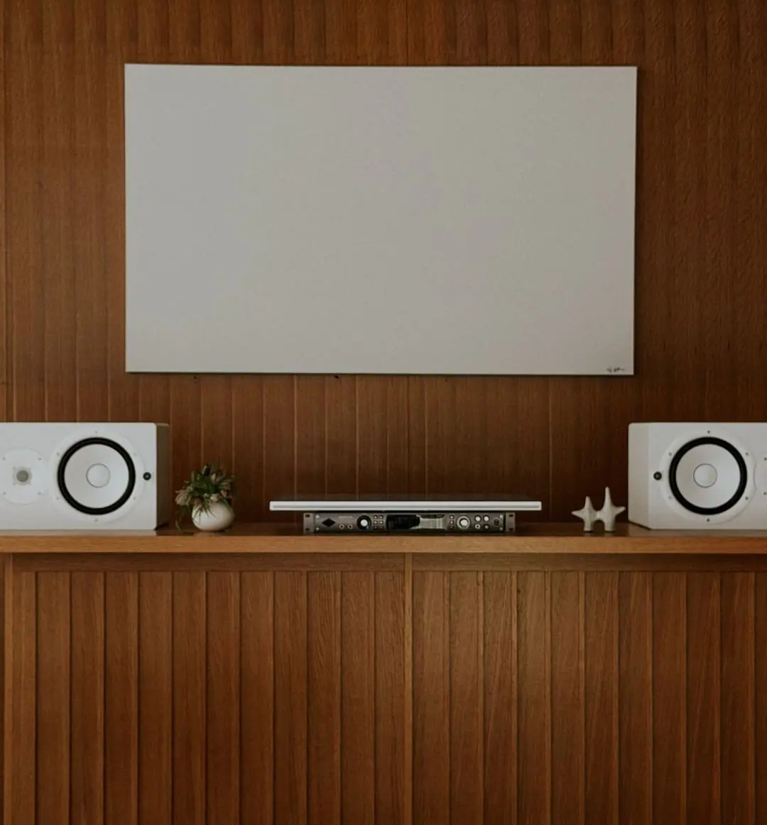 A wood-panelled wall with speakers in the Currently Running store at Signal