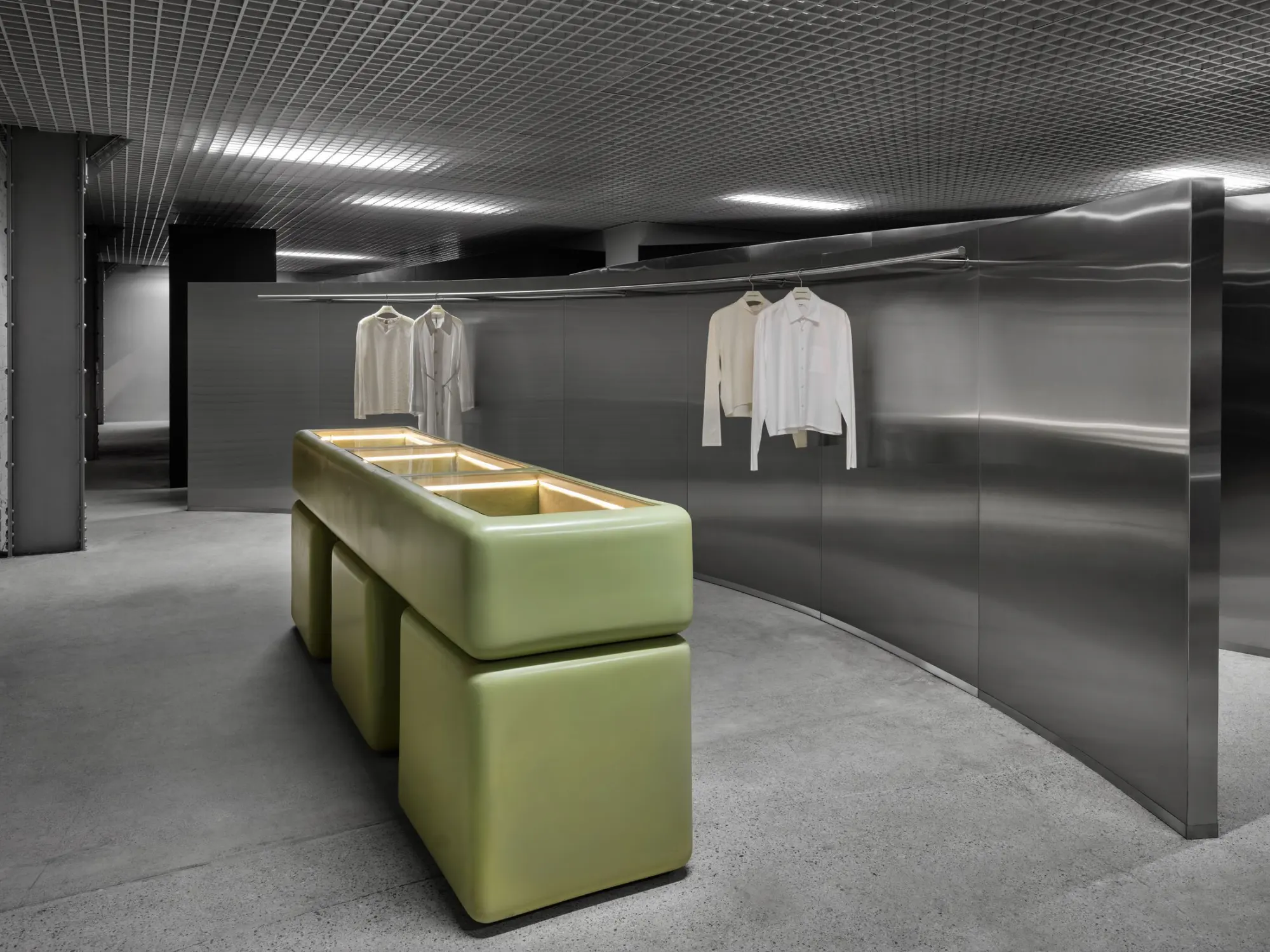 A green counter and steel walls inside Departamento at Signal