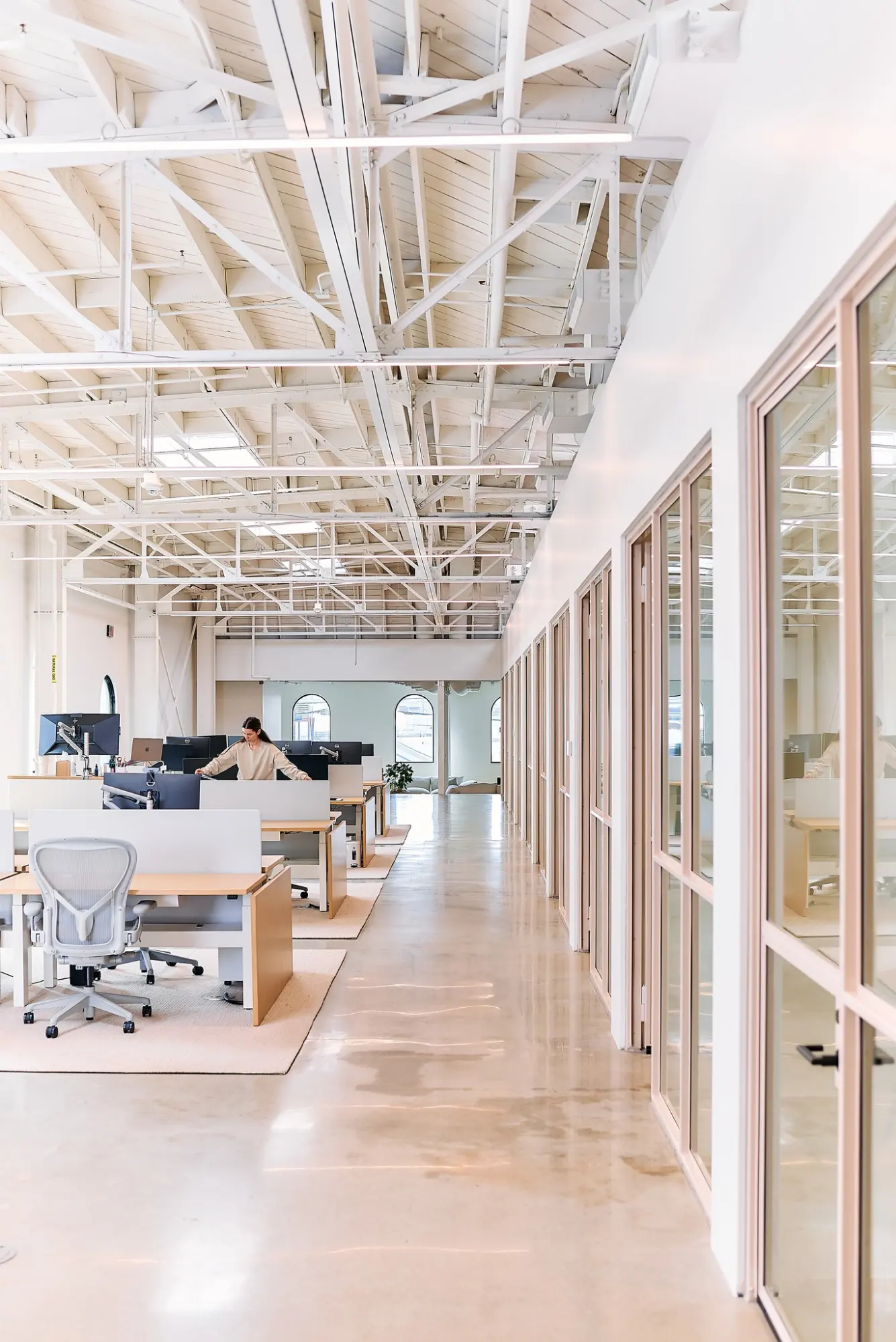 A glass-walled corridor in the Greycroft office at Signal
