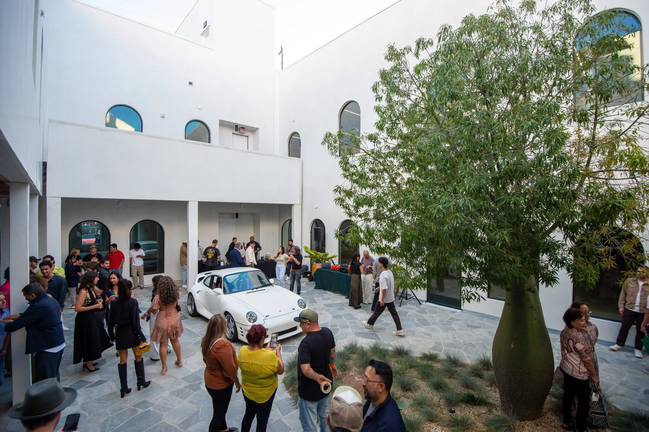 Guests at an event in the courtyard at Signal