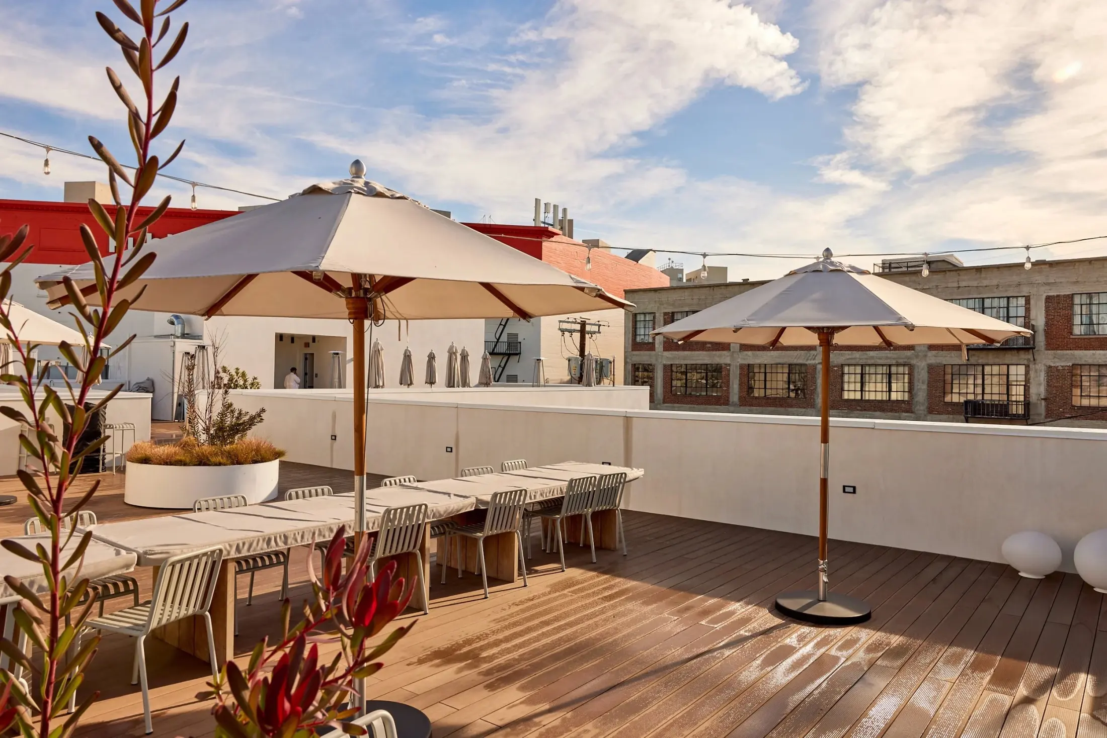 Long tables and umbrellas on the roof at Signal