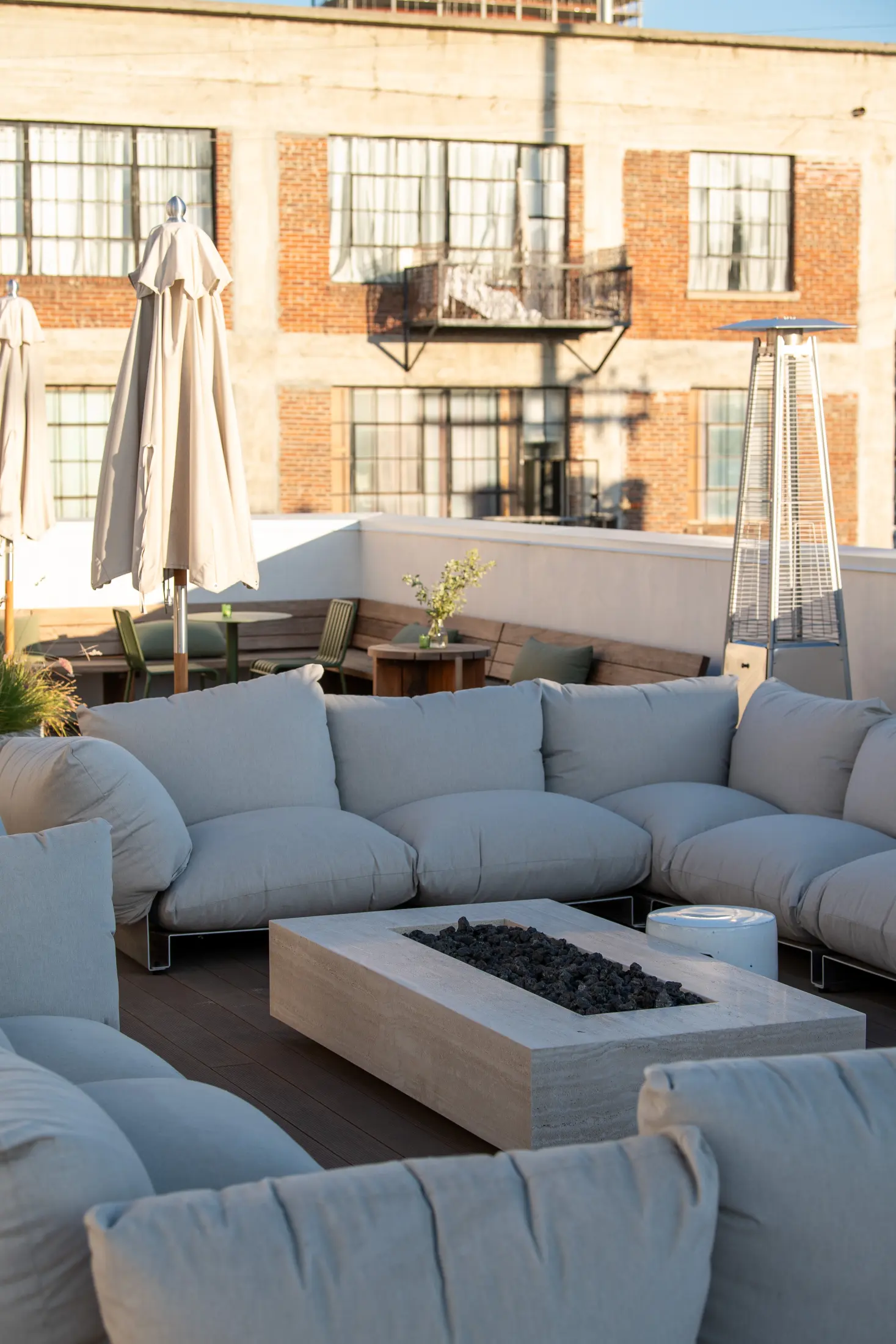 Lounge seating around a fire table on the roof at Signal