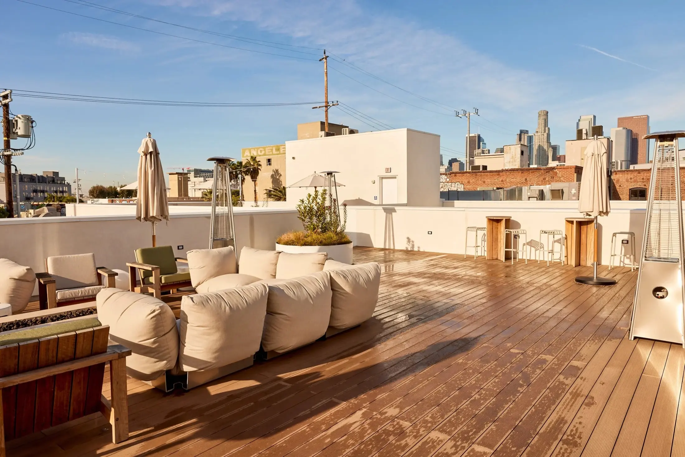 Sofas on the roof at Signal under a big sky, with the downtown Los Angeles skyline