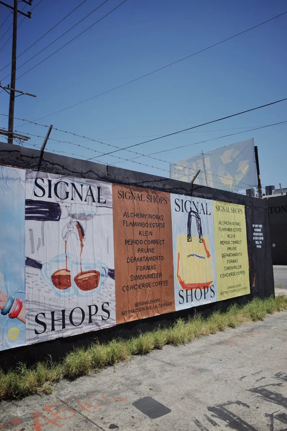 Signal wheatpaste posters along a wall on Traction Ave